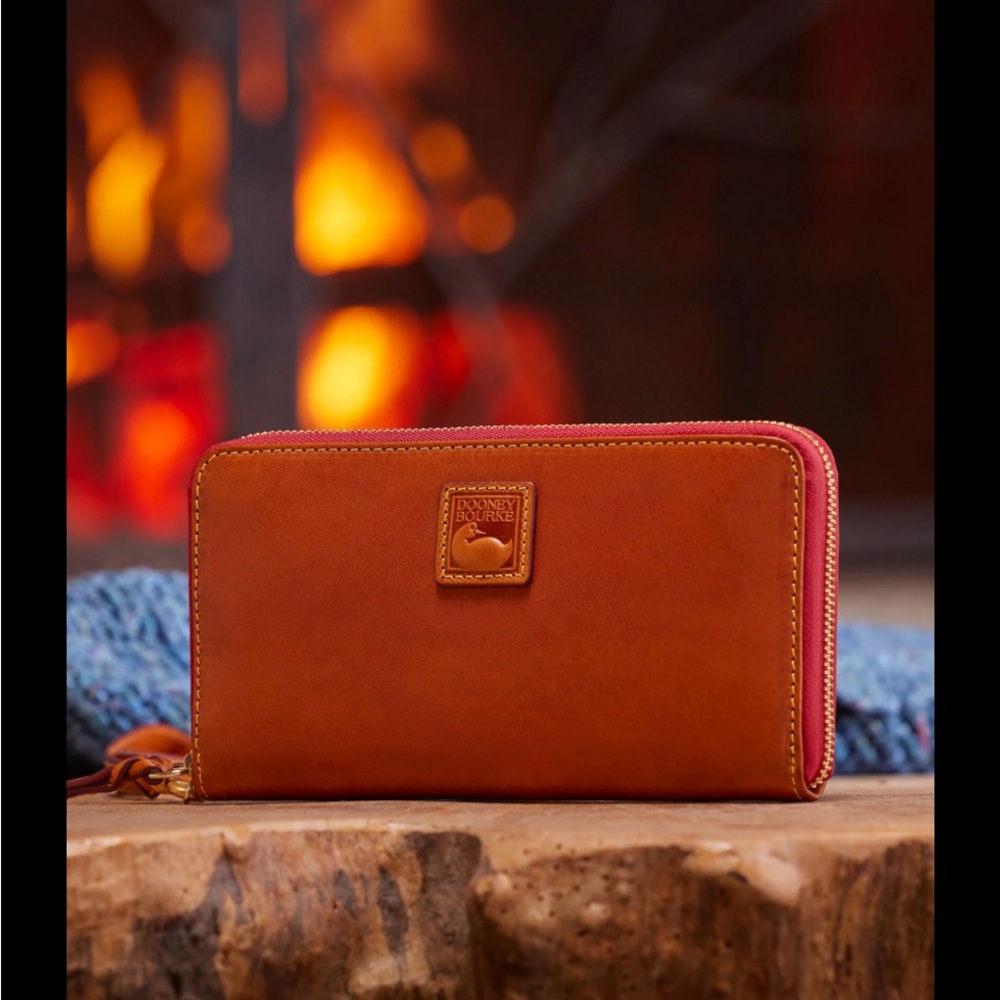 Women’s Dooney & Burke large zip around wristlet wallet.